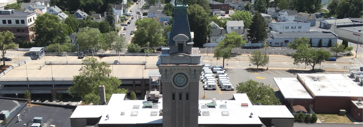 Greenwood Industries team completing historical restoration of Marlborough City Hall clock tower masonry and architectural metal.