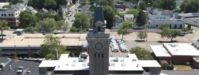 Greenwood Industries team completing historical restoration of Marlborough City Hall clock tower masonry and architectural metal.
