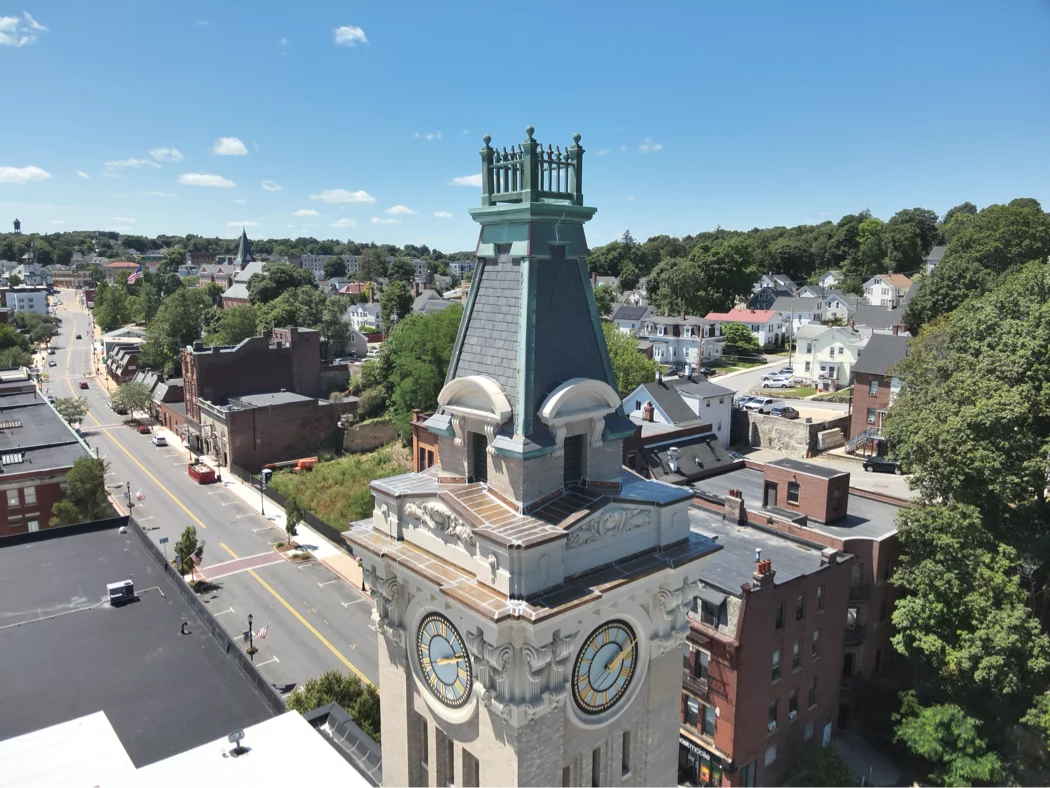 Greenwood Industries team completing historical restoration of Marlborough City Hall clock tower masonry and architectural metal.