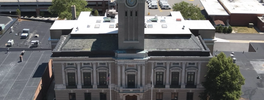 Greenwood Industries team completing historical restoration of Marlborough City Hall clock tower masonry and architectural metal.
