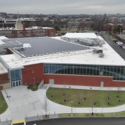 Drone photograph of the front of Boston College High School’s Patrick Cadigan ’52 Family Foundation Wellness Center with a Greenwood Industries installed commercial roof.