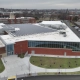 Drone photograph of the front of Boston College High School’s Patrick Cadigan ’52 Family Foundation Wellness Center with a Greenwood Industries installed commercial roof.