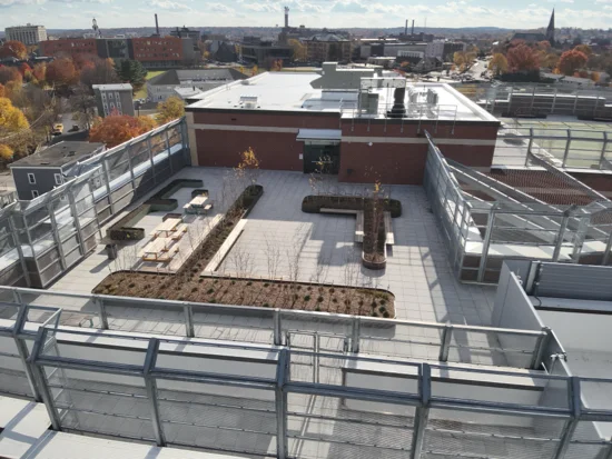 Rooftop lounge installed for school staff at Francis Leahy Elementary featuring a paver deck on a Hydrotech commercial roof system installed by Greenwood Industries